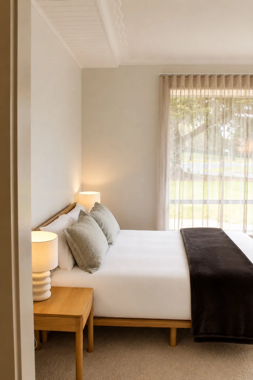 Main bedroom with queen bed and garden outlook