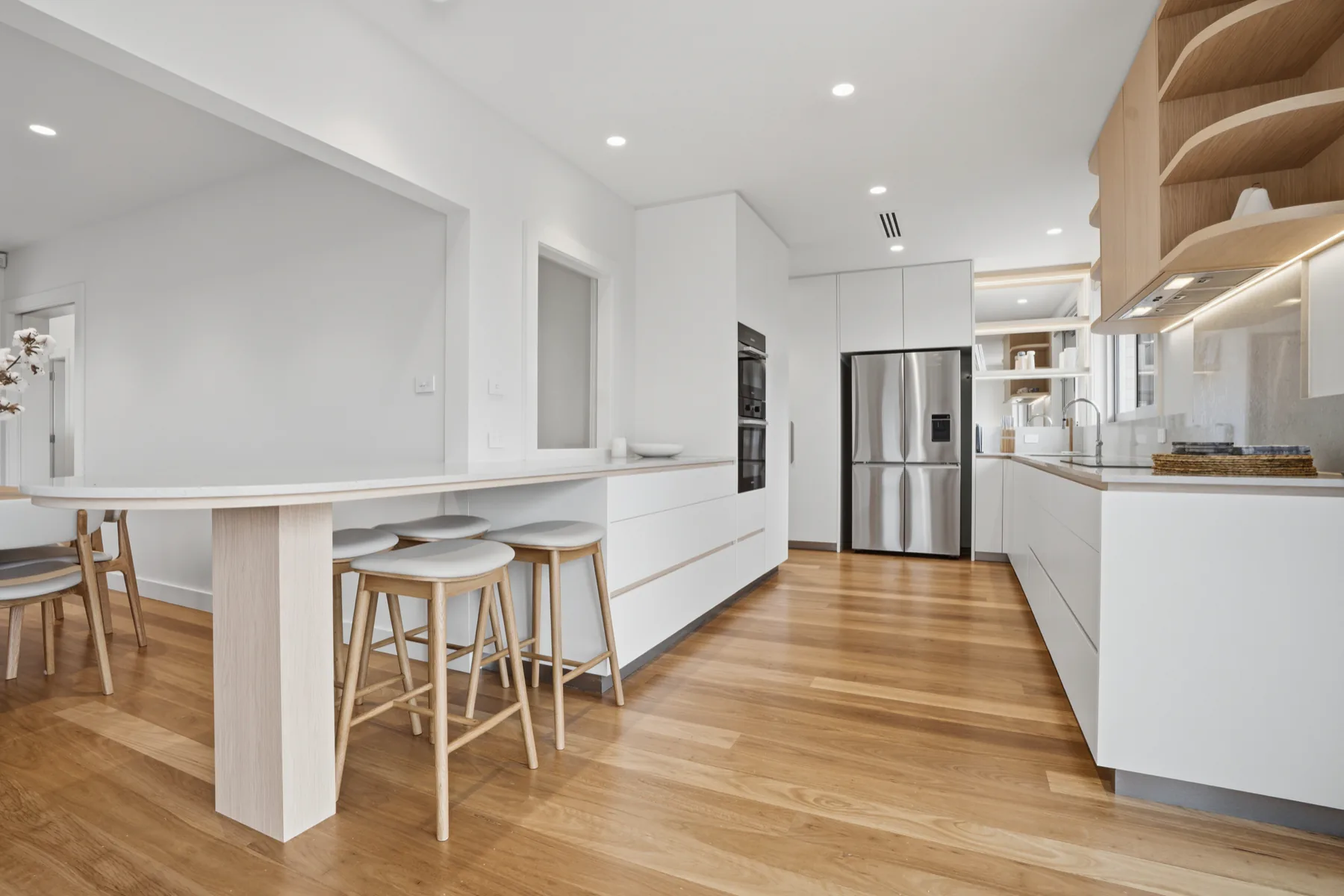 The kitchen at The Dalton, with stone benchtops and breakfast bar seating