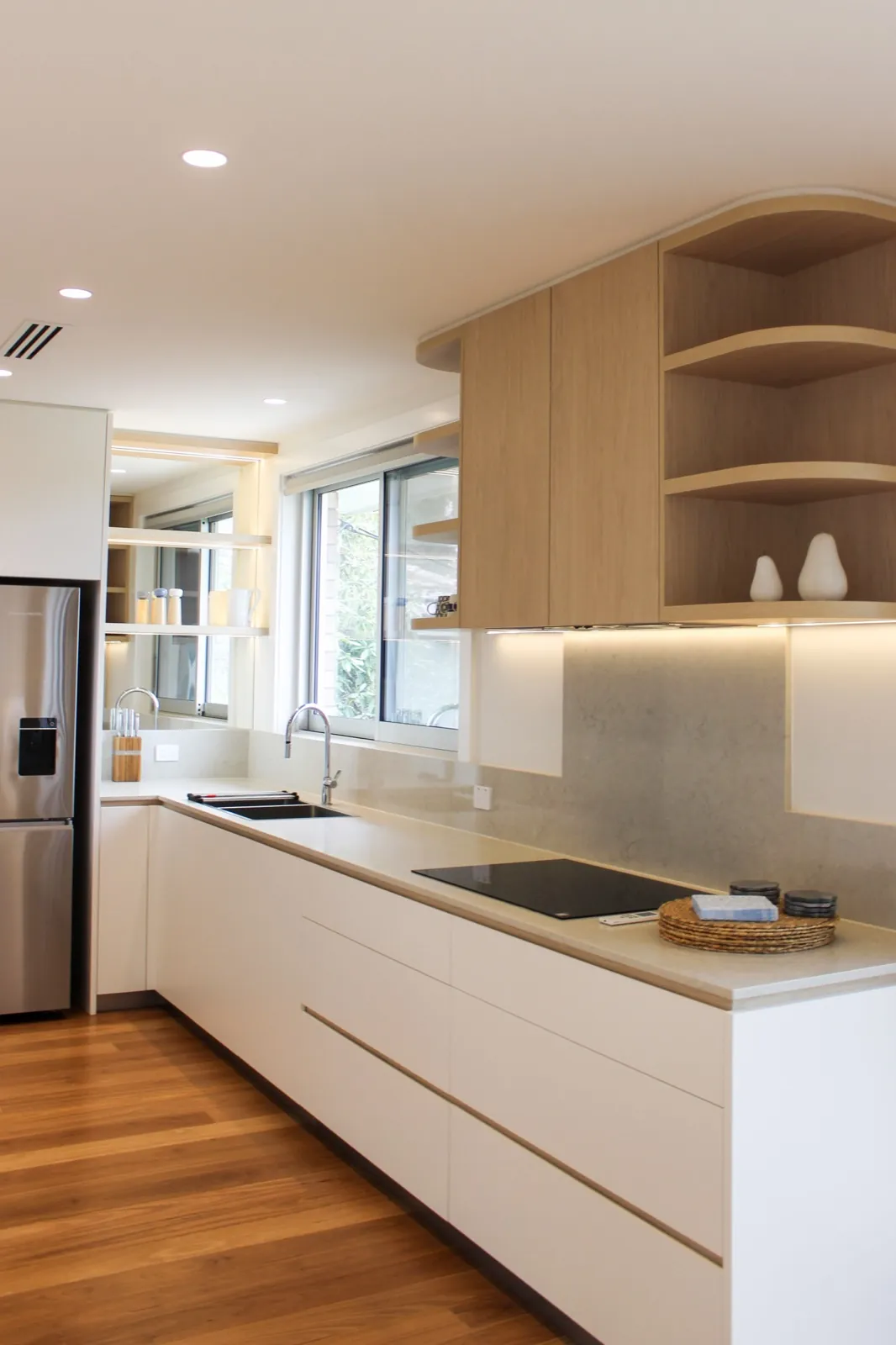 Renovated kitchen with stone benchtops and oak joinery